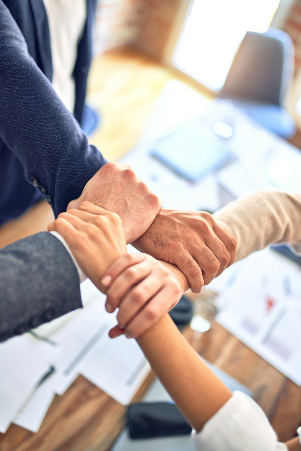 Hands joined together in teamwork